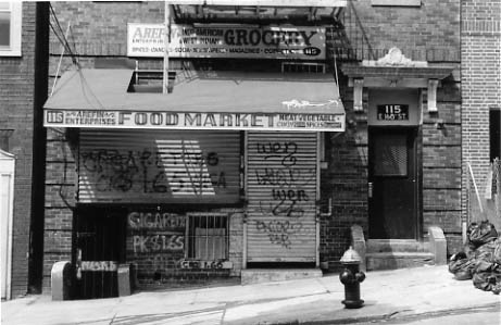 Beginnings: a basement mosque with masjid painted on lower left corner, the Bronx.