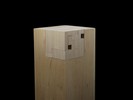 Photograph of bass wood cube model on basewith shifted portions of the cube.