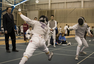 MIT fencer attacks his opponent.