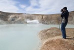 Student shooting pictures of hot spring.