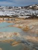 Students hiking between sulfurous geothermal springs and snow field.