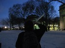 Photo of a student studying the object through her tube.