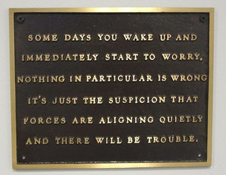 Plaque showing a Jenny Holzer poem engraving.