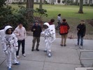 Two students are "astronauts" while several others monitor their progress with walkie-talkies.