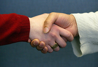 Two people shaking hands.