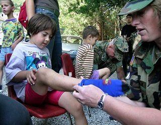 A little girl gets new shoes and socks.